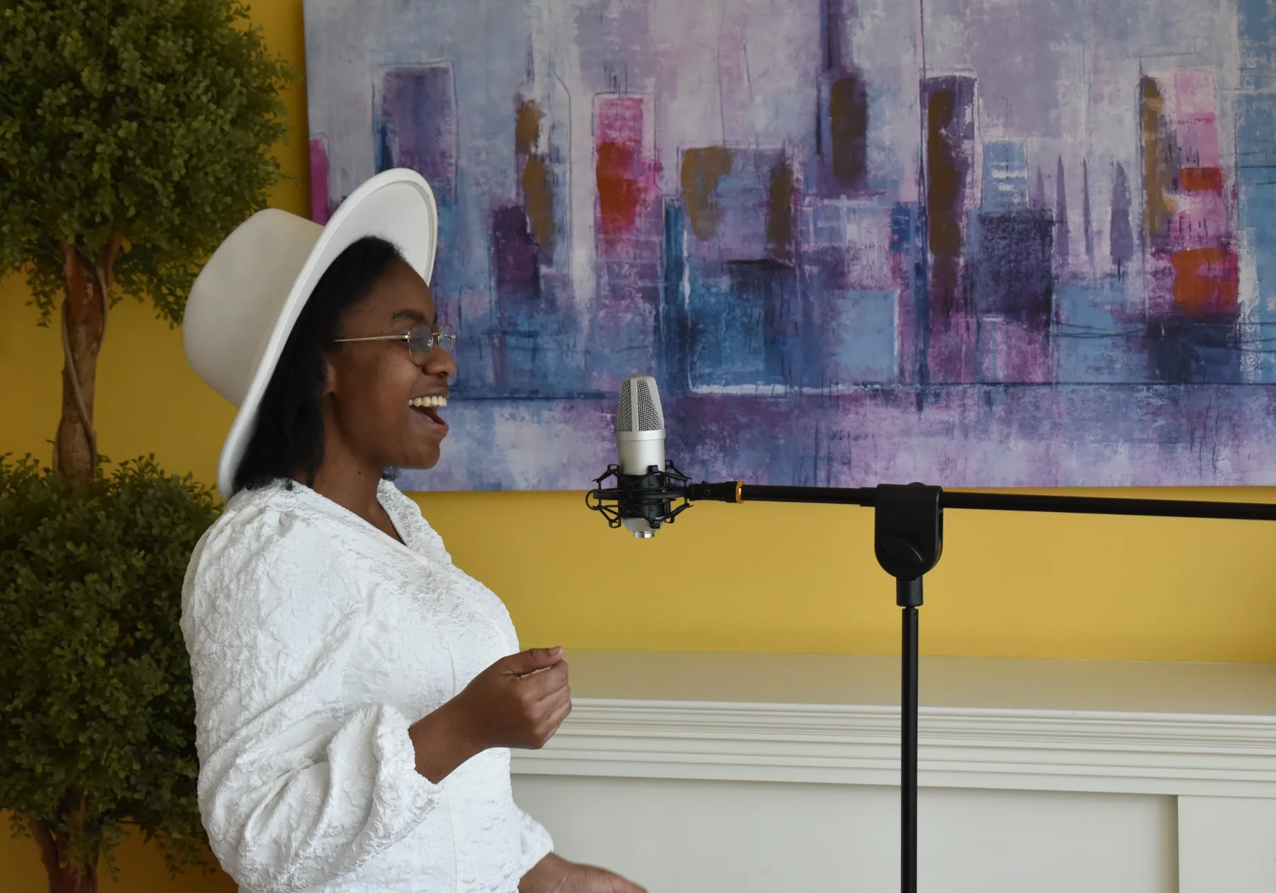 EsterWill singing into a studio microphone